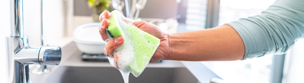 soapy sponge being squeezed out under water