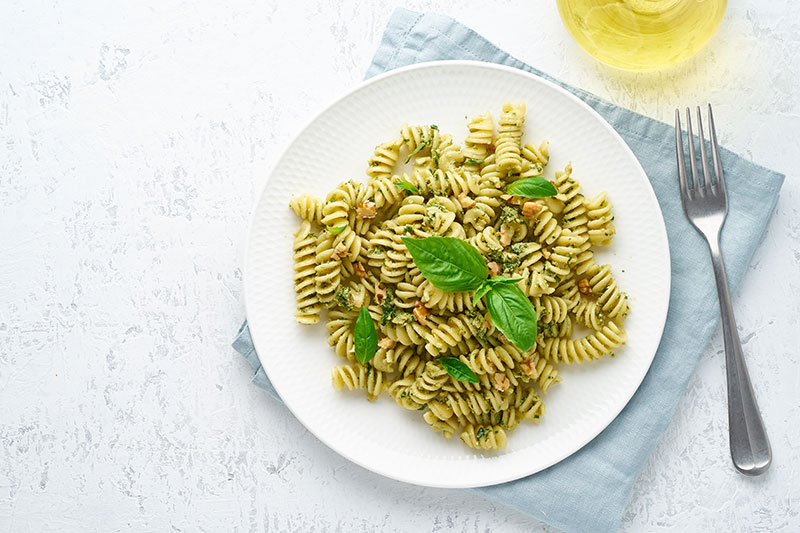 A plate of fresh pesto pasta