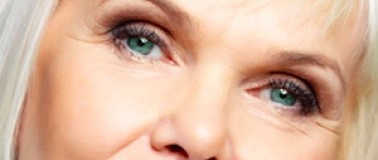 Close up of a woman with straight, sleek gray hair