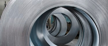 Rolls of industrial metal sheet lubricated with Magiesol