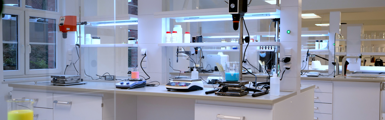 Beakers of formulations are being evaluated in the Esson Solution Center lab.