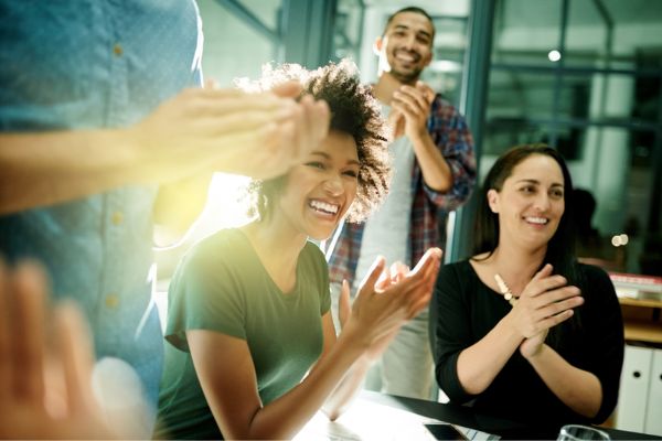 People clapping in an office