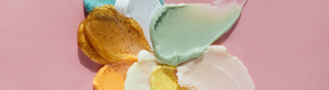 Nature inspired make-up and remover ingredients on a pink background